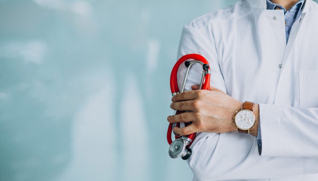 Quality Engineering Trends in Healthcare. young handsome physician in a medical robe with stethoscope